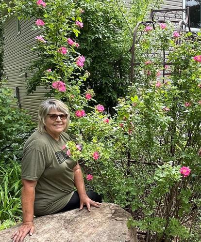 Debi Decker sitting on rock