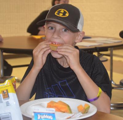 Myles Harlander eats his melon