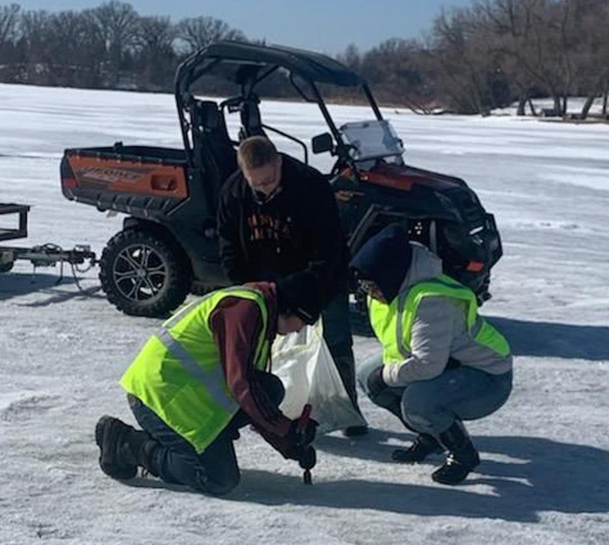 Volunteers helping Collin Noyes