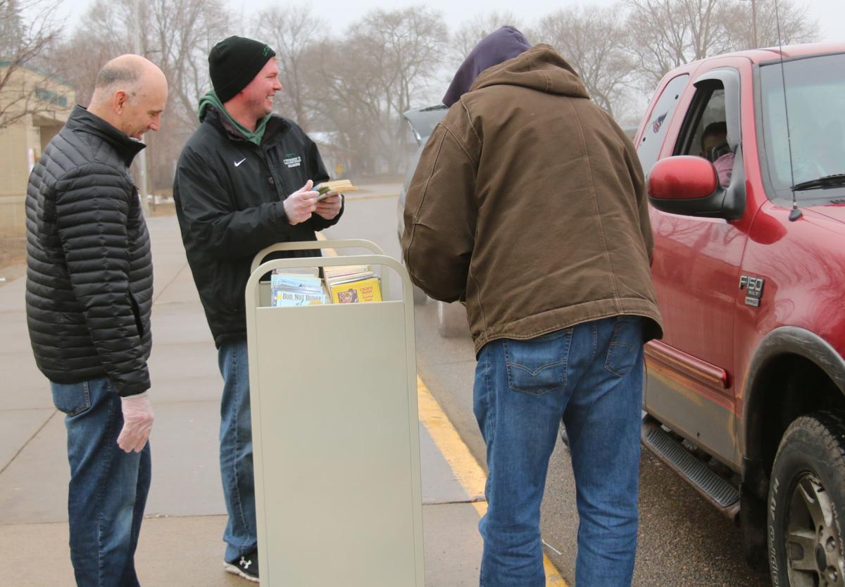 Giving out free books.JPG